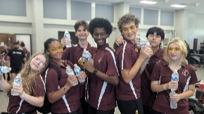 Benton band students pose before traveling to away game.